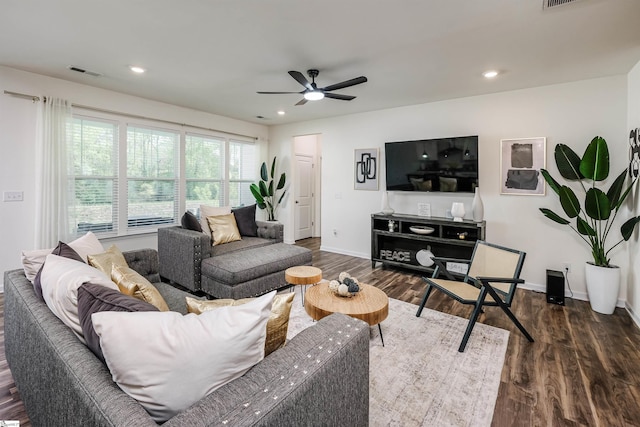 living area with dark wood-type flooring, ceiling fan, visible vents, and recessed lighting