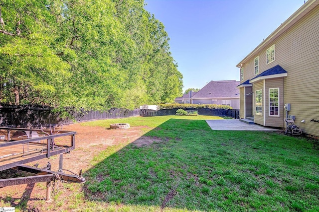 204 Kaplan Ct, Simpsonville, SC 29681 - fenced backyard with a fire pit and a patio