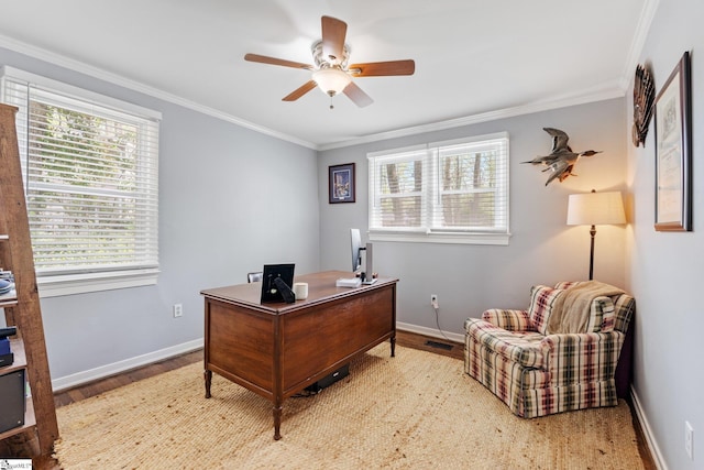 office area featuring crown molding, ceiling fan, and baseboards