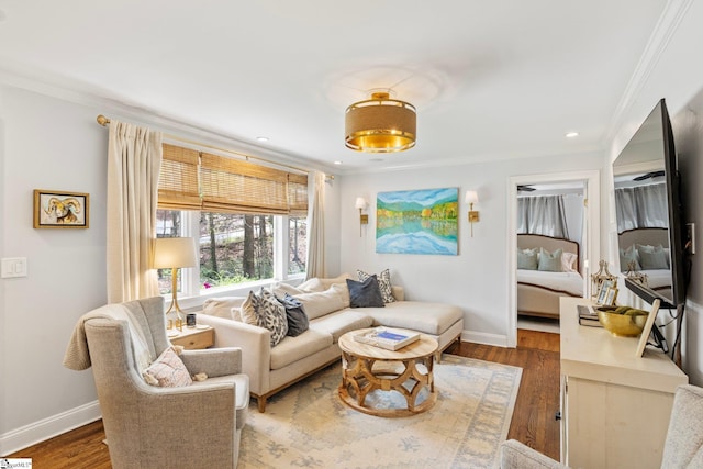 living area featuring crown molding, baseboards, and dark wood finished floors