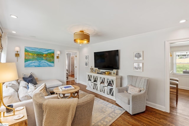 living area with ornamental molding, baseboards, recessed lighting, and wood finished floors