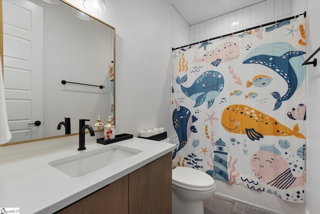 full bathroom featuring shower / tub combo, toilet, and vanity