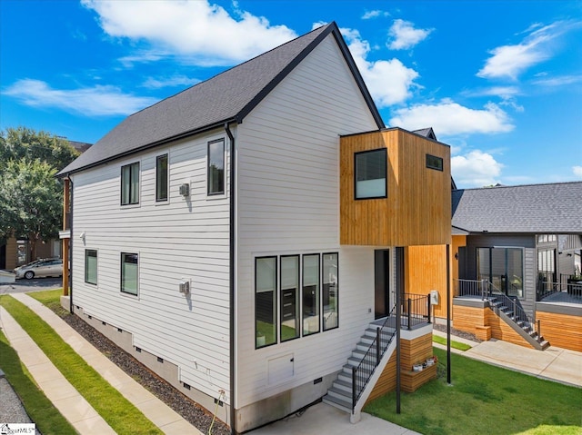 view of home's exterior featuring crawl space and a yard