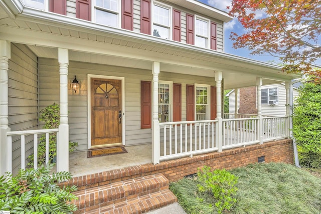 property entrance featuring a porch