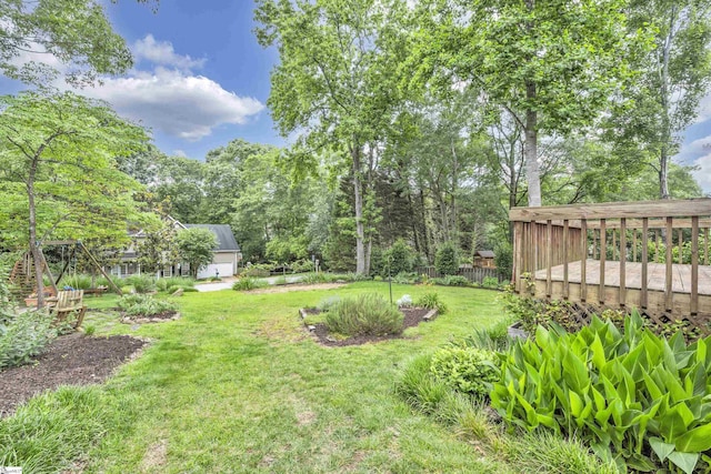 view of yard with a wooden deck and fence