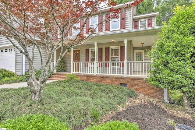 townhome / multi-family property featuring covered porch