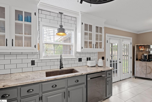 kitchen featuring ornamental molding, french doors, gray cabinetry, dishwasher, and a sink