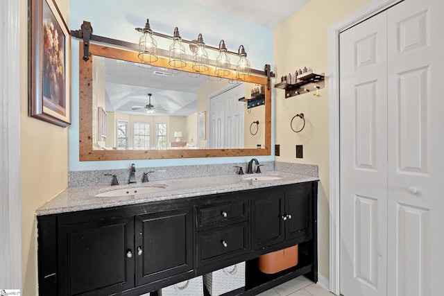 bathroom featuring double vanity, a sink, and a ceiling fan