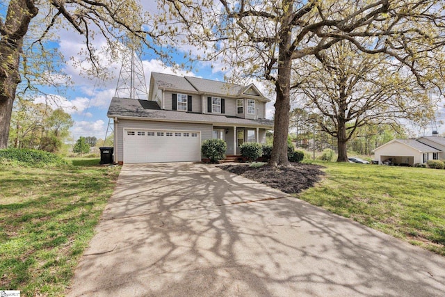 traditional-style home with a front lawn, a shingled roof, a garage, and driveway