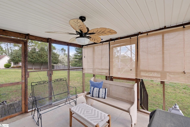sunroom / solarium featuring ceiling fan