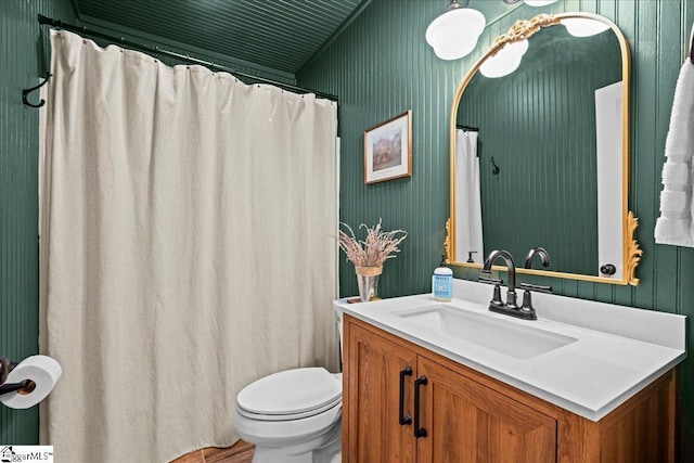 full bathroom with toilet and vanity