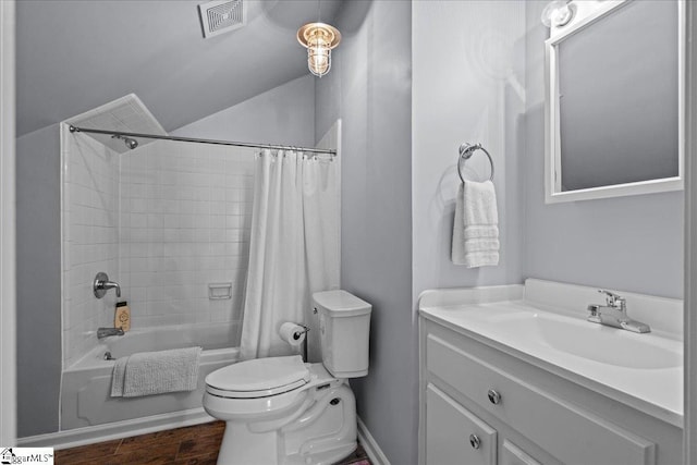 full bath featuring vanity, visible vents, toilet, wood finished floors, and shower / tub combo with curtain