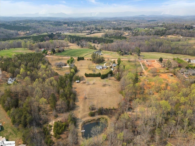 birds eye view of property with a rural view and a mountain view