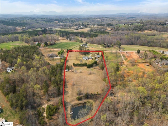 bird's eye view featuring a mountain view and a rural view
