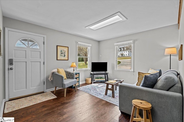 living room with dark wood-style floors and baseboards