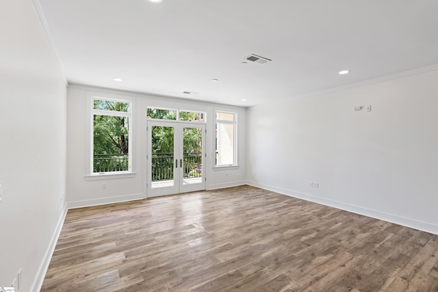 98 E Mcbee Ave Unit 205, Greenville, SC 29601 - empty room with visible vents, french doors, crown molding, and wood finished floors