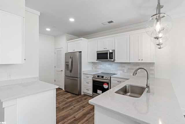 98 E Mcbee Ave Unit 205, Greenville, SC 29601 - kitchen featuring a peninsula, appliances with stainless steel finishes, a sink, and light stone countertops