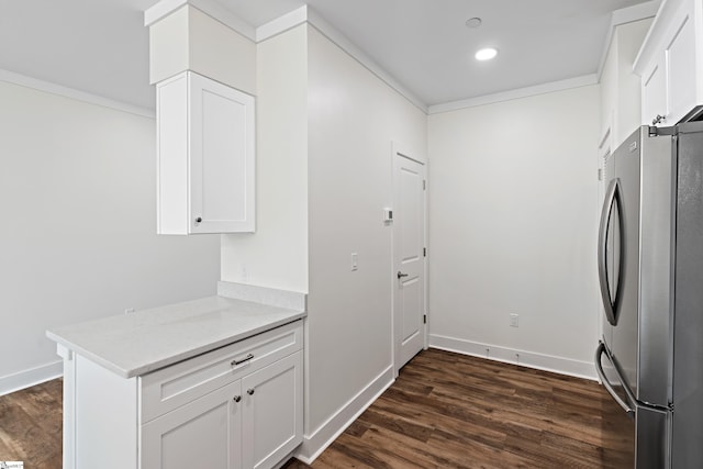 98 E Mcbee Ave Unit 205, Greenville, SC 29601 - interior space featuring dark wood-style floors, baseboards, crown molding, and cabinet space