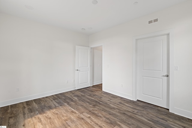 98 E Mcbee Ave Unit 205, Greenville, SC 29601 - spare room with visible vents, baseboards, and dark wood-style floors
