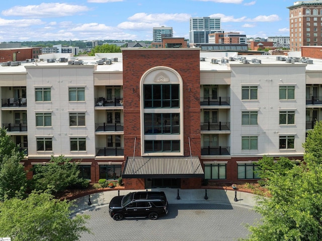 98 E Mcbee Ave Unit 205, Greenville, SC 29601 - view of building exterior featuring a city view