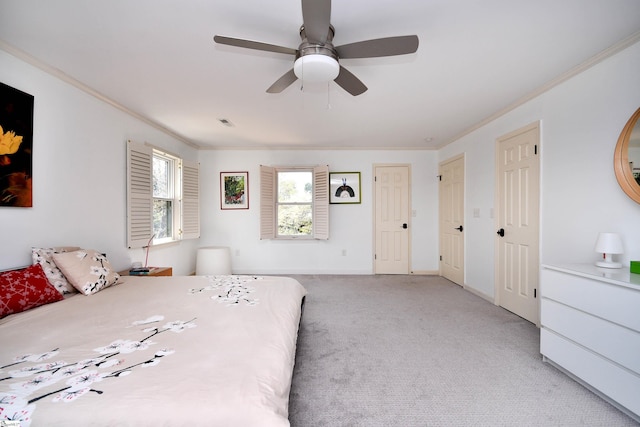 bedroom featuring crown molding, visible vents, baseboards, and light carpet