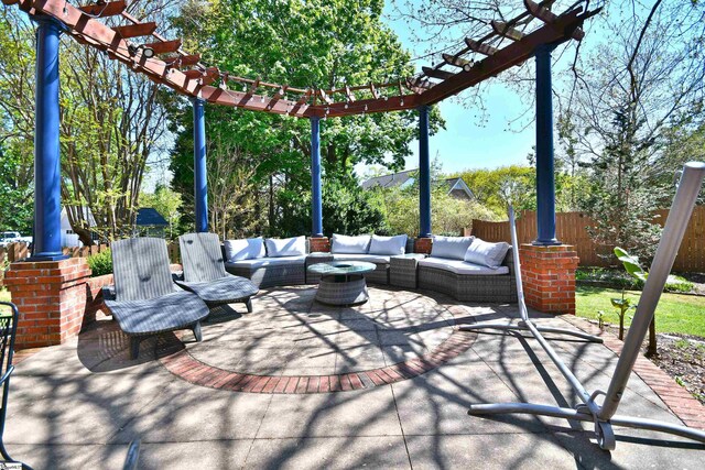 view of patio / terrace featuring an outdoor living space, fence, and a pergola