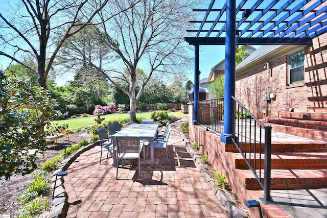 view of patio featuring outdoor dining space and a pergola