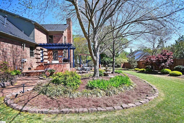 view of yard featuring a pergola and fence
