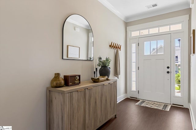 entrance foyer with crown molding, visible vents, a wealth of natural light, and dark wood-style floors