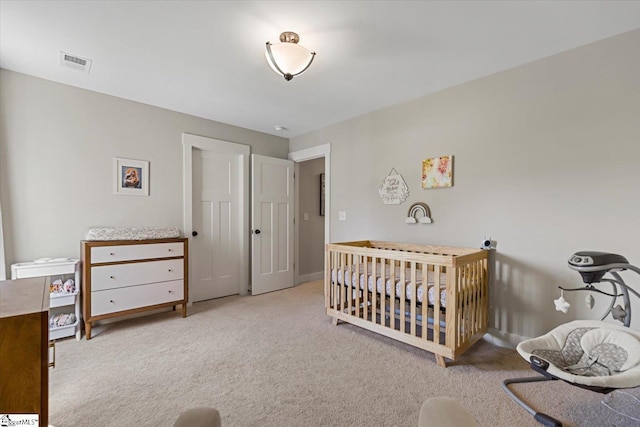 bedroom featuring carpet flooring, baseboards, and visible vents