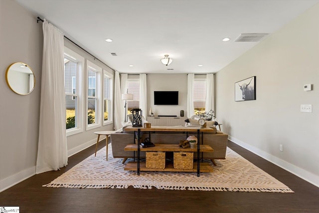 office with wood finished floors, baseboards, visible vents, and recessed lighting