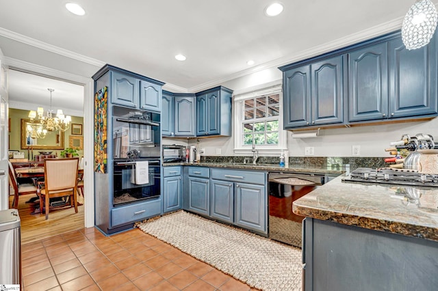 kitchen with a notable chandelier, ornamental molding, light tile patterned flooring, black appliances, and blue cabinets