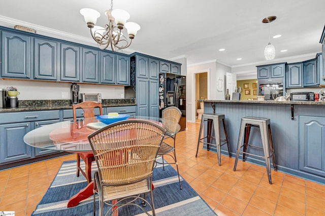 dining room with recessed lighting, light tile patterned floors, a notable chandelier, and ornamental molding