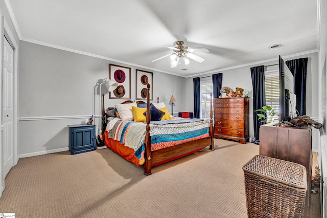 bedroom featuring crown molding, baseboards, a ceiling fan, and carpet