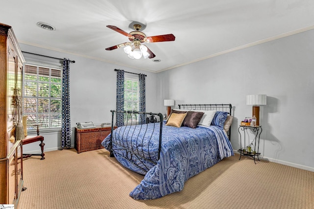 carpeted bedroom with ornamental molding, visible vents, baseboards, and a ceiling fan