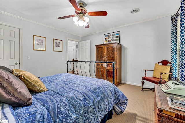 bedroom featuring visible vents, baseboards, crown molding, and carpet floors