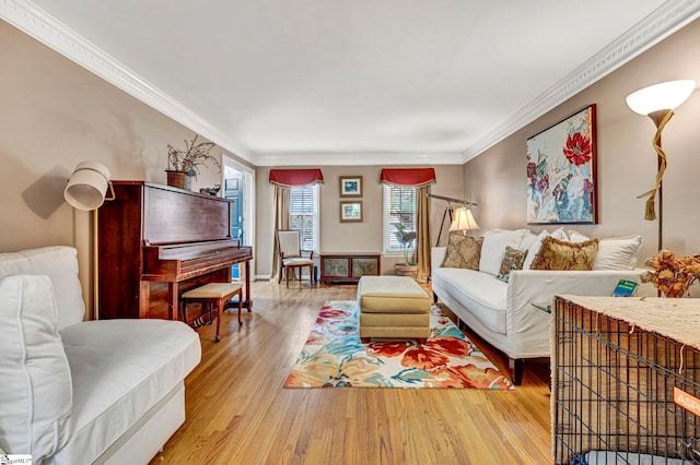 living room with crown molding and wood finished floors