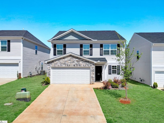traditional-style home with a garage, central air condition unit, a front yard, stone siding, and driveway