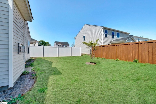 view of yard with a fenced backyard and cooling unit