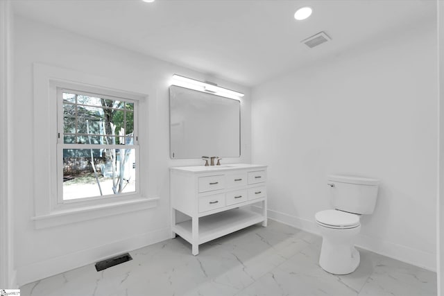 bathroom with visible vents, marble finish floor, and baseboards