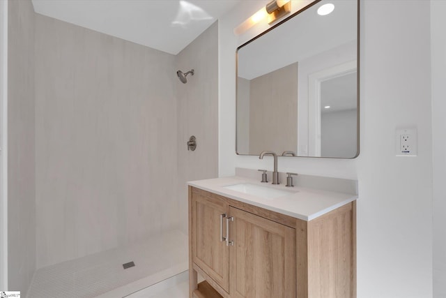 bathroom featuring vanity and walk in shower