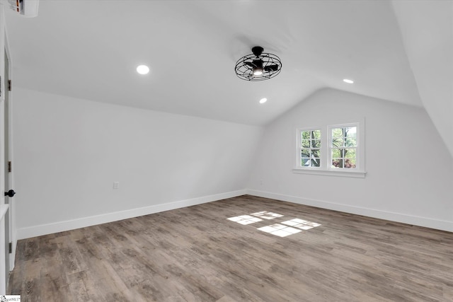bonus room with baseboards, wood finished floors, and lofted ceiling
