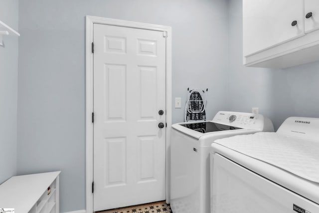 laundry room with cabinet space and washer and dryer