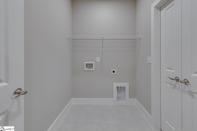 washroom featuring laundry area, baseboards, hookup for a washing machine, and electric dryer hookup