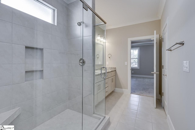 full bathroom with tile patterned floors, crown molding, and a stall shower