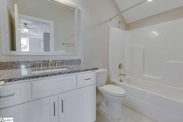 bathroom featuring vanity, toilet, lofted ceiling, tile patterned floors, and shower / bathing tub combination