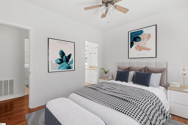 bedroom with baseboards, a ceiling fan, connected bathroom, visible vents, and wood finished floors