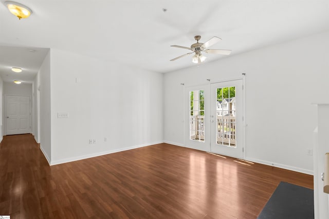 unfurnished living room featuring baseboards, a ceiling fan, and wood finished floors