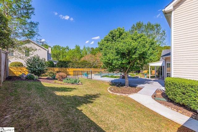 view of yard featuring a patio area and fence
