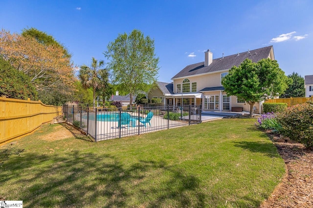 view of swimming pool with a fenced in pool, a patio, a fenced backyard, and a yard